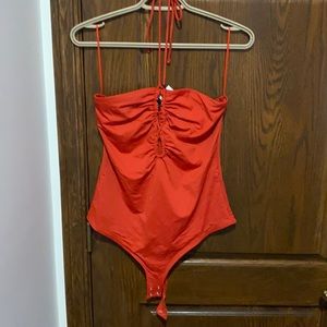 Red bodysuit with spaghetti tie around neck